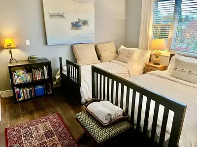 a bedroom with a bed and a couch at Corkscrew Willow Estate in Vancouver