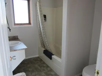 a bathroom with a shower and a sink at Monte Carlo Motel in Barrière