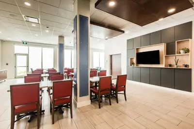 a conference room with a long table and chairs at Holiday Inn Express & Suites Edmonton N - St Albert by IHG in St. Albert