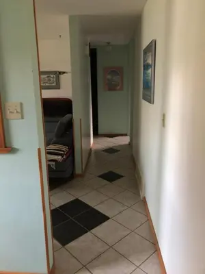 a hallway with a hallway leading to a room at Queen, walk to village center in Whitehorse