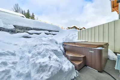 a pile of snow on the side of a house at Echo Landing#02 By Bear Country in Sun Peaks