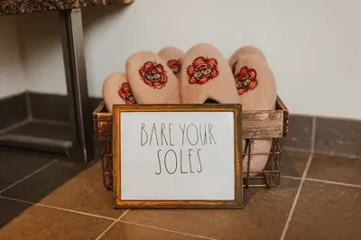 a sign that says dance your self with feet in sandals at Ambleside Lodge Bed & Breakfast in Canmore