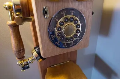 a close up of a wooden door with a telephone at North House - Banff Mountain Home- The Real Rockies Experience in Banff