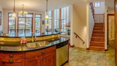 a kitchen with a sink and a counter at Woodhaven #11 by Bear Country in Sun Peaks