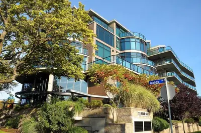 a building with a street sign in front of it at Harbourview Executive Condo by EMR Vacation Rentals in Victoria