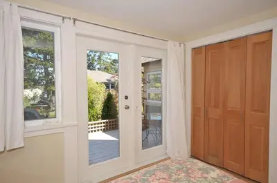 an entry door to a home with a porch at Heron View Cottage by EMR Vacation Rentals in Sidney