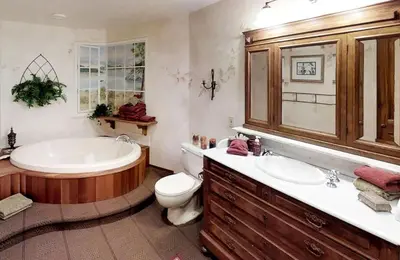 a bathroom with a tub and a toilet and a sink at Oceanside Lodge Saanich Inlet by EMR Vacation Rentals in North Saanich