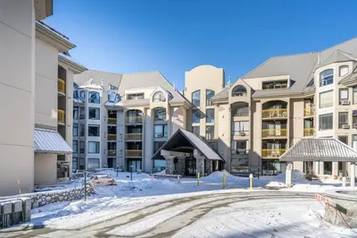 a large apartment building with snow on the ground at Mountain View Penthouse- 2BR Oasis at the Marquise in Whistler in Whistler