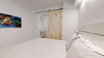 a bedroom with a bed and a painting on the wall at 1BR and Sofabed at Whistler on the Lake, Lakefront, Serene Setting, Wood Burning Fireplace in Whistler