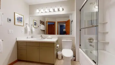 a bathroom with a toilet and a sink and a shower at 2BR in Northstar, Whistler Village, Fireplace, Hot Tub, Central Location, Ski Storage in Whistler