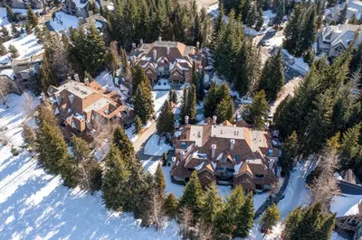 an aerial view of a house in the snow at 3BR in Gleneagle, Soaker Tub with Skylight, Wood Burning Fireplace, Spacious Layout in Whistler