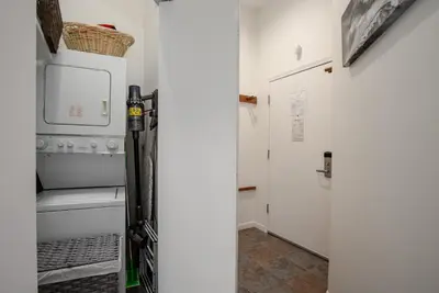 a kitchen with a stove and a refrigerator at 3BR in Tyndall Stone Lodge, Village Location with Olympic Plaza Views, Fireplace, Hot Tub in Whistler