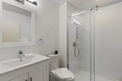 a bathroom with a shower and a toilet and a sink at 4BR in Blueberry Hill Estates, Lake View, Tranquil Setting, Gourmet Kitchen, Family Sized in Whistler