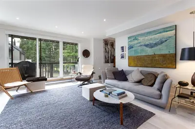 a living room with a couch and a table at 2BR in The Gables, Steps to Gondolas, Heated Floors, Private Balcony, Fireplace in Whistler
