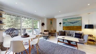a living room with a couch and a table at 2BR in The Gables, Steps to Gondolas, Heated Floors, Private Balcony, Fireplace in Whistler