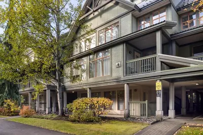 a large house with a tree in front of it at 1BR in Northstar, Village Location, Shared Pool and Hot Tub, Ski Storage, Free Parking in Whistler