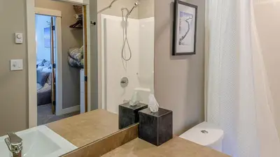 a bathroom with a sink and a toilet at Echo Landing #05 by Bear Country in Sun Peaks