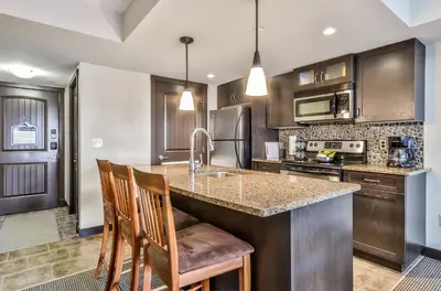 a kitchen with a sink and a counter top at SCENIC 1 Bedroom plus Den, PET FRIENDLY managed by Little Sister Getaways in Dead Man's Flats
