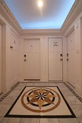 a room with two doors and a tile floor at Lipton Place by Elegant Waterfront in Victoria