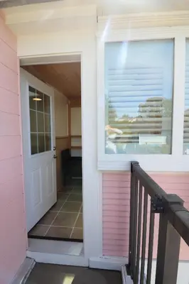 a door leading into a pink house at Lipton Place by Elegant Waterfront in Victoria