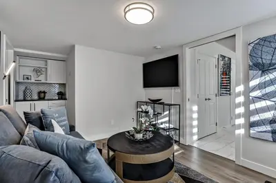 a living room with a couch and a table at The Parq by Samsara Resort Top View Downtown 4BR & 3BTH in Canmore