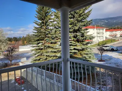 a view of a christmas tree from a balcony at Fairmont Mountain View Villas in Fairmont Hot Springs