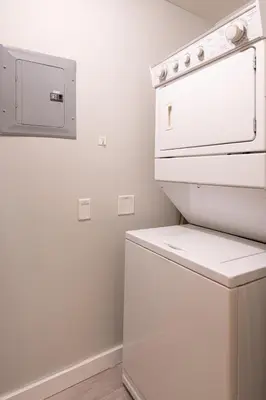 a kitchen with a white stove and a dishwasher at Top Floor Condo - 2BR & AC with Mountain Views in Canmore