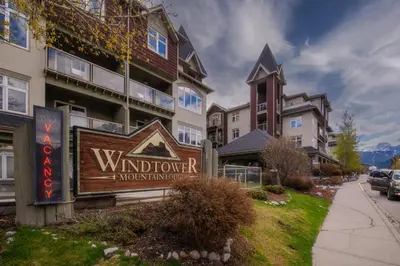 a sign in front of a building at Top Floor Condo - 2BR & AC with Mountain Views in Canmore