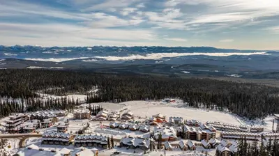 an aerial view of a ski resort in the snow at I Spy - Cozy Pet Friendly, Ski In Ski Out Condo with Private Hot Tub in Big White