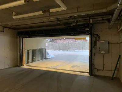 an empty room with an open door to a parking lot at Windtower Lodge - Canmore in Canmore