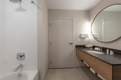 a bathroom with a sink and a mirror at Fairfield by Marriott Inn & Suites Revelstoke in Revelstoke