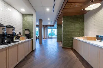 a lobby with a cafeteria with aasteryasteryasteryasteryasteryasteryasteryasteryastery at Fairfield by Marriott Inn & Suites Revelstoke in Revelstoke