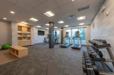 a gym with treadmills and ellipticals in a building at Fairfield by Marriott Inn & Suites Revelstoke in Revelstoke