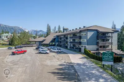 a parking lot in front of a large building at Griz Inn by StayIn in Fernie