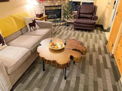 a living room with a couch and a coffee table at MountainView -PrivateChalet Sleep7- 5min to DT Vacation Home in Canmore