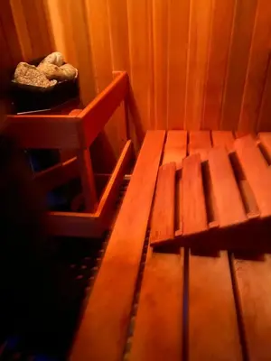 a room with a wooden bench in a room at JoyVeal’s Homey Place in Sechelt