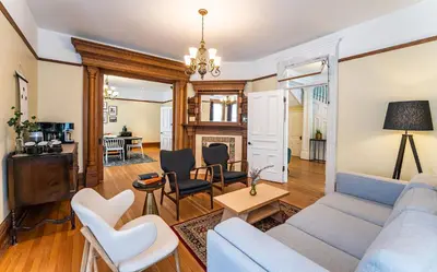 a living room with a blue couch and chairs at The Copeland in Revelstoke