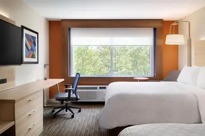 a hotel room with a bed and a desk and a window at Holiday Inn Express & Suites - Chilliwack East an IHG Hotel in Chilliwack