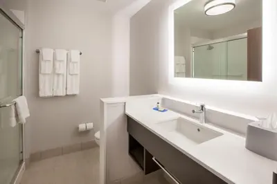 a white bathroom with a sink and a mirror at Holiday Inn Express & Suites - Chilliwack East an IHG Hotel in Chilliwack