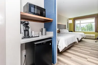 a hotel room with a bed and a coffee machine at Holiday Inn Express & Suites - Chilliwack East an IHG Hotel in Chilliwack