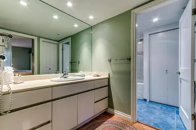 a bathroom with a sink and a mirror at Wintergreen 27 - Townhome in Whistler