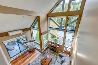 an overhead view of a living room with large windows at Greystone Lodge 408 Luxury in Whistler