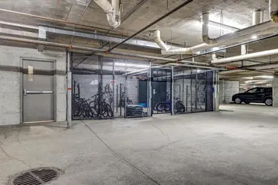 a garage with a bunch of bikes on the wall at Greystone Lodge 333 Ski-in Out in Whistler