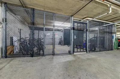 an empty garage with a large metal gate at Greystone Lodge 328 Ski-in Out in Whistler