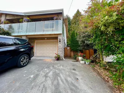a car parked in front of a garage at Resort style home living in Delta