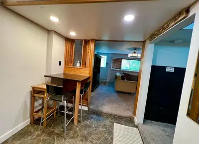 a kitchen with a table and chairs in a room at Resort style home living in Delta