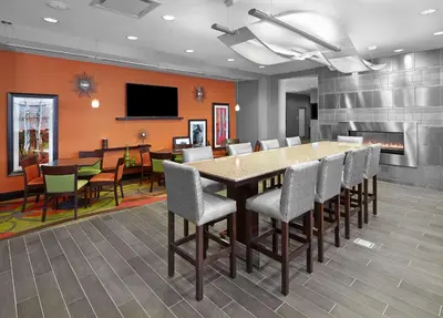 a conference room with a large table and chairs at Hampton Inn by Hilton Calgary Airport North in Calgary