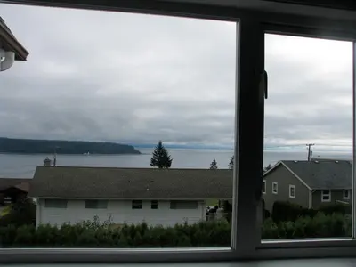 a view of a house from a window at Fireflies Bed & Breakfast in Campbell River