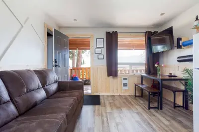 a living room with a couch and a table at The Valley View Cabins and Event Center in Creston