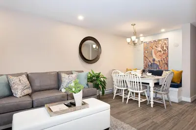 a living room with a couch and a table at Renovated & Spacious 1bed/2bath Whistler Village in Whistler